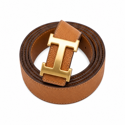 H belt features a gold-tone Togo leather strap